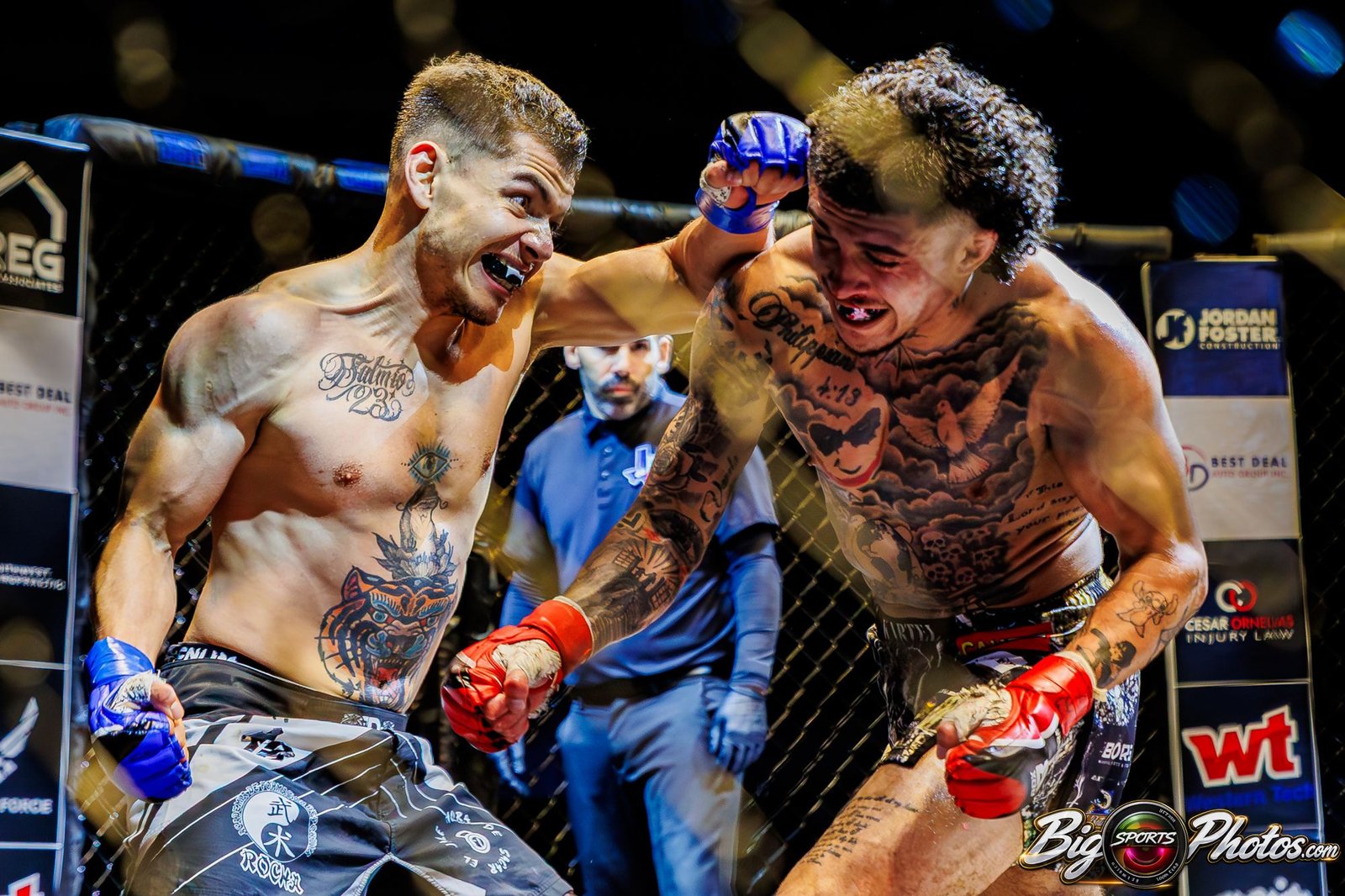 Two MMA fighters locked in an exchange against the cage